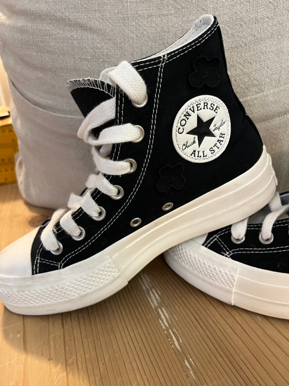 Converse Black and White High-Top Sneakers with black floral details